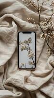 Cell Phone on White Sheet photo