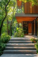 Modern architectural entrance surrounded by lush greenery in the afternoon light photo