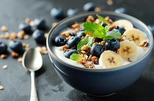 Yogurt Parfait With Granola, Banana, and Blueberries photo