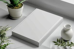 Blank White Book Mockup With Sunlight and Leaf Shadows photo