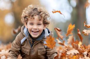 Boy Laughing in Autumn Forest photo