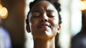 Woman expressing joy and relaxation indoors during a social gathering photo