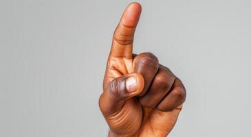 A Close-Up Photo of a Persons Index Finger Pointing Upward