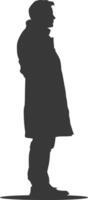 Silhouette of a man in a coat and hat vector