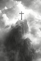 Dramatic mountain peak with a cross, surrounded by clouds and an expansive sky at sunrise photo
