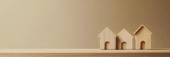 Wooden model houses on a smooth surface with a warm background in a calm interior setting photo