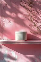 Decorative arrangement of vases and branches on a pink mantelpiece during daylight hours photo
