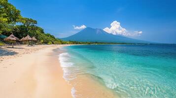 Calm coastal landscape featuring clear waters and a distant mountain range on a sunny day photo