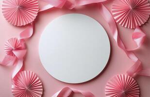 Decorative pink background with blank circle and ribbon for celebrations or invitations photo