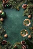 Celebratory champagne and ornaments arranged on a festive green background during holiday season photo