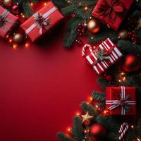Holiday gifts with red decor and shimmering lights on a vibrant red backdrop photo