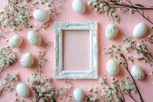 Elegant decorative arrangement of white eggs and blossoms on a pink background for spring photo