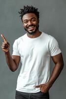 Young man showing number one gesture with a confident smile against a textured gray background photo