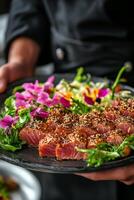 Elegant platter of sesame crusted salmon garnished with fresh herbs and vibrant flowers photo