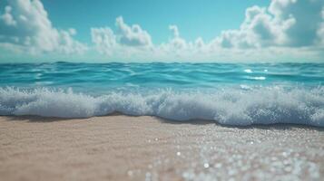 Gentle waves lap against sandy shore under bright blue sky with fluffy clouds in midday photo