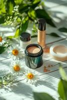 Cosmetics arranged on a wooden surface with daisies and green foliage in natural light photo
