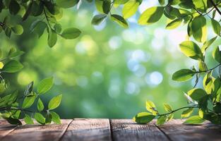 Bright green leaves with bokeh background on wooden surface in a serene outdoor setting photo