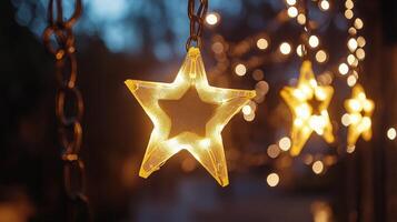 Glowing star decorations illuminate a charming evening garden setting with twinkling lights photo