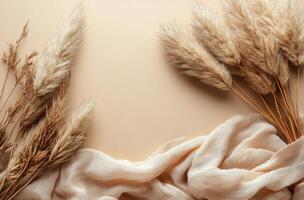Soft pampas grass arranged elegantly on a light background with flowing fabric in natural tones photo