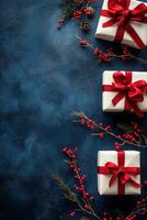 Neatly wrapped white gifts with red ribbons on a dark blue background for festive occasions photo