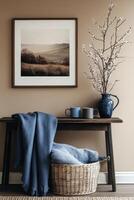 Cozy entryway decor with a vintage table, botanical accents, and framed art in a neutral toned space photo
