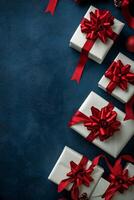 Neatly wrapped white gifts with red ribbons on a dark blue background for festive occasions photo