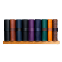 Row of colorful leather rolls on wooden shelf isolated on transparent background png