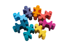 Colorful puzzle pieces interconnected symbolizing teamwork, collaboration, problem-solving, and connection in a vibrant, playful image. png