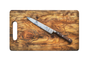 Rustic knife on a wooden cutting board, suitable for kitchen themes in stock photography. High-resolution image. png