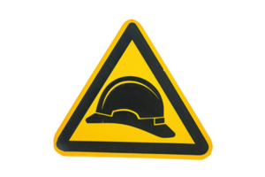 Yellow triangular safety sign with a black hard hat icon indicating a construction or caution area. Isolated on a transparent background. png