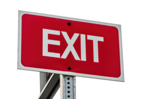 Red exit sign with white letters mounted on a metal post, isolated on transparent background. Ideal for directional, safety, and informational purposes. png