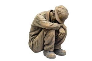 Bronze statue of a melancholic man sitting with knees drawn up and head down, depicting loneliness and contemplation, isolated on transparent background. png