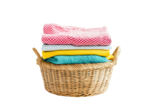 A wicker laundry basket filled with neatly folded colorful clothes isolated on a transparent background. png