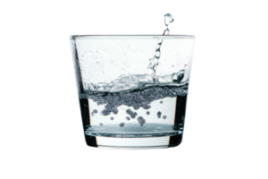 Close-up of a clear glass of water, capturing the dynamic splash and bubbles, isolated on a transparent background. png