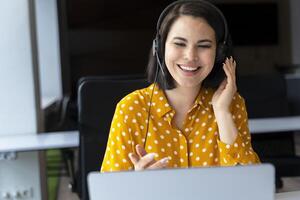 Happy customer service operator working in a call center photo