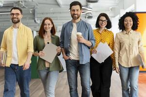 Startup business team walking and smiling in modern office photo