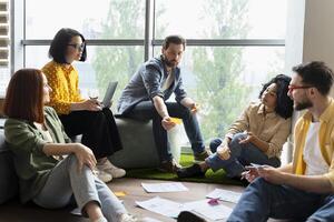 Diverse team of professionals brainstorming using sticky notes photo