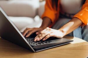 Copywriter typing on keyboard, using laptop, selective focus on hands. Online technology concept photo