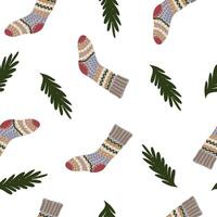 christmas seamless pattern with with socks and fir branches vector