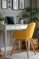 Bright yellow chair beside a modern desk in a stylish home office with plants and decor photo