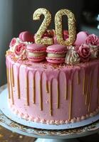 Celebration cake with pink frosting and macarons, featuring a sparkling 20th birthday topper photo