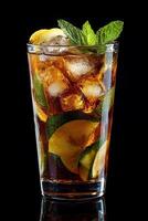 Vibrant fruits and mint in a refreshing summer drink, served in a clear glass photo