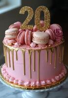 Celebration cake with pink frosting and macarons, featuring a sparkling 20th birthday topper photo