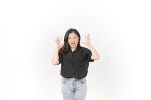 beautiful Asian woman in an angry pose, shouting with frustration, her intense expression clear against a white background photo