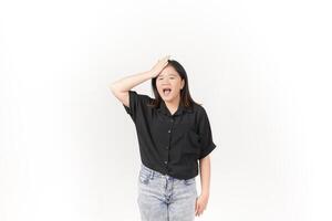 beautiful Asian woman holds her head in pain, with a pained expression showing signs of a headache against a white background photo