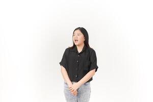 beautiful Asian woman turns to the side, looking intently and shouting, with a dramatic expression against a white background photo