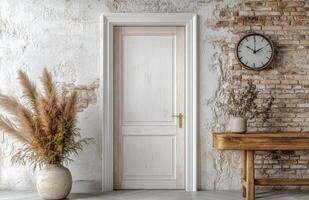 Modern interior design featuring a white door, stone wall, and a wooden table with decor photo