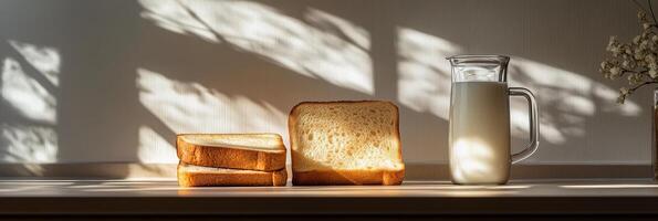 A modern toaster with two slices of golden brown bread on a kitchen counter with decorative elements photo