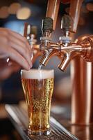 Pouring a fresh draft beer at a lively bar during the evening hours with friends nearby photo
