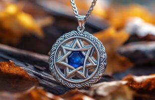 Shimmering blue star shaped pendant resting on a wooden surface, showcasing intricate design details photo